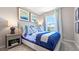 Bright bedroom with a double bed, window, and nightstand at 1210 Balsam Dr, Davenport, FL 33837