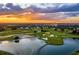 Golf course community with lake and sunset views at 1239 Radiant St, Reunion, FL 34747