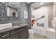 Bathroom with rock and roll themed shower curtain at 1239 Radiant St, Reunion, FL 34747