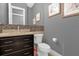 Modern bathroom with granite countertops, white cabinets, and a large walk-in shower at 1239 Radiant St, Reunion, FL 34747