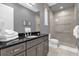 Bathroom with a walk-in shower and granite countertop at 1239 Radiant St, Reunion, FL 34747