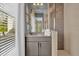 Bathroom with shower, vanity, and granite countertop at 1239 Radiant St, Reunion, FL 34747