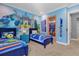 ' bedroom with twin beds, Monsters University mural and ensuite bathroom at 1239 Radiant St, Reunion, FL 34747