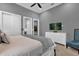 King-size bed in a gray bedroom with TV at 1239 Radiant St, Reunion, FL 34747