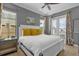 Main bedroom with king-size bed and yellow pillows at 1239 Radiant St, Reunion, FL 34747