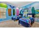 ' bedroom with twin beds and playful Monsters University themed decor at 1239 Radiant St, Reunion, FL 34747