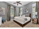 Spacious bedroom with king-size bed and gray walls at 1239 Radiant St, Reunion, FL 34747