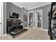Bedroom with a keyboard and a view into the bathroom at 1239 Radiant St, Reunion, FL 34747