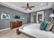 Main bedroom with king bed and access to ensuite bathroom at 1239 Radiant St, Reunion, FL 34747
