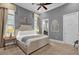 King-size bed in a light gray bedroom at 1239 Radiant St, Reunion, FL 34747
