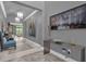 Elegant hallway with artwork and modern light fixtures at 1239 Radiant St, Reunion, FL 34747