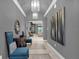 Elegant hallway with tile flooring and modern artwork at 1239 Radiant St, Reunion, FL 34747