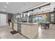 Open concept kitchen with island, stainless steel appliances, and granite countertops at 1239 Radiant St, Reunion, FL 34747
