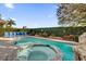 Inviting pool and spa with ample lounge chairs at 1239 Radiant St, Reunion, FL 34747