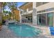 Private pool and spa with rock waterfall feature at 1239 Radiant St, Reunion, FL 34747