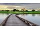 Scenic wooden bridge overlooking the golf course and lake at 1239 Radiant St, Reunion, FL 34747