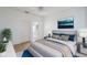 Virtually staged main bedroom with ensuite bathroom, carpeted floors, and a ceiling fan at 146 Piano Ln, Davenport, FL 33896