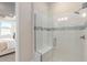 Walk-in shower with glass enclosure and tile at 2326 Daisy Tree Rd, St Cloud, FL 34771