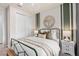 Bedroom with window, metal bed frame, and closet at 2326 Daisy Tree Rd, St Cloud, FL 34771