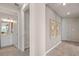 Neutral-toned hallway with access to bathroom and other rooms at 2326 Daisy Tree Rd, St Cloud, FL 34771