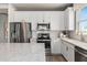 Modern kitchen with stainless steel appliances and white cabinetry at 2326 Daisy Tree Rd, St Cloud, FL 34771