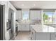 Spacious kitchen featuring stainless steel appliances and white cabinets at 2326 Daisy Tree Rd, St Cloud, FL 34771