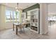 Home office with built-in shelves and large window at 2326 Daisy Tree Rd, St Cloud, FL 34771