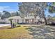 Single-story house with a well-maintained lawn and landscaping at 302 W Sweetwater Creek Drive Dr, Longwood, FL 32779