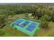 Aerial view of community tennis courts near a lake at 302 W Sweetwater Creek Drive Dr, Longwood, FL 32779