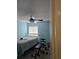 Bedroom with light blue walls, a double bed, and a weight bench at 3563 S Saint Lucie Dr, Casselberry, FL 32707