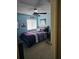 Bedroom with light blue walls, double bed, and a drum set at 3563 S Saint Lucie Dr, Casselberry, FL 32707