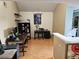 Spacious dining area with large window and a home office at 3563 S Saint Lucie Dr, Casselberry, FL 32707