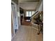Bright entryway with tile flooring, leading to living room and staircase at 3563 S Saint Lucie Dr, Casselberry, FL 32707