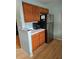 Kitchen with wood cabinets and stainless steel refrigerator at 3563 S Saint Lucie Dr, Casselberry, FL 32707