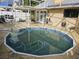 Octagon shaped pool with surrounding patio at 3563 S Saint Lucie Dr, Casselberry, FL 32707