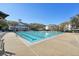 Community pool with multiple lap lanes and surrounding lounge chairs at 3601 Parkland Dr, Orlando, FL 32814