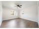 Bright bedroom with hardwood floors and large windows at 3805 N Lake Orlando Pkwy, Orlando, FL 32808