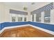 Elegant dining room with hardwood floors and blue accent wall at 451 Seminole St, Clermont, FL 34711