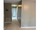 Clean hallway with neutral-colored walls and tile floors at 4617 Frisco Cir, Orlando, FL 32808