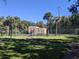 Well-maintained tennis court with surrounding green space at 4818 S Semoran Blvd # 508, Orlando, FL 32822