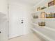 White pantry with ample shelving and storage space at 6247 Chorus Dr, Mascotte, FL 34753