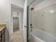 Bathroom with tub and shower, access to a walk-in closet at 8120 Roseville Blvd, Champions Gate, FL 33896