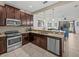 Modern kitchen with stainless steel appliances and granite countertops at 8120 Roseville Blvd, Champions Gate, FL 33896