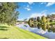Serene lakefront view with bridge and lush landscape at 12096 Talitha Ln, Orlando, FL 32827