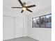 Bright bedroom with white walls, ceiling fan, and sliding door closet at 1315 Wheeler Rd, Apopka, FL 32703