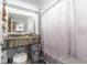 Updated bathroom with granite countertop and large mirror at 151 E Washington St # 201, Orlando, FL 32801
