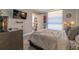 Bright bedroom with a large window and plush bedding at 151 E Washington St # 201, Orlando, FL 32801
