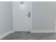 White door with gray walls and wood-look flooring at 151 E Washington St # 201, Orlando, FL 32801