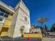 Modern building exterior with palm trees and signage at 151 E Washington St # 201, Orlando, FL 32801