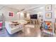 Modern living room with white sectional sofa and large TV at 151 E Washington St # 201, Orlando, FL 32801